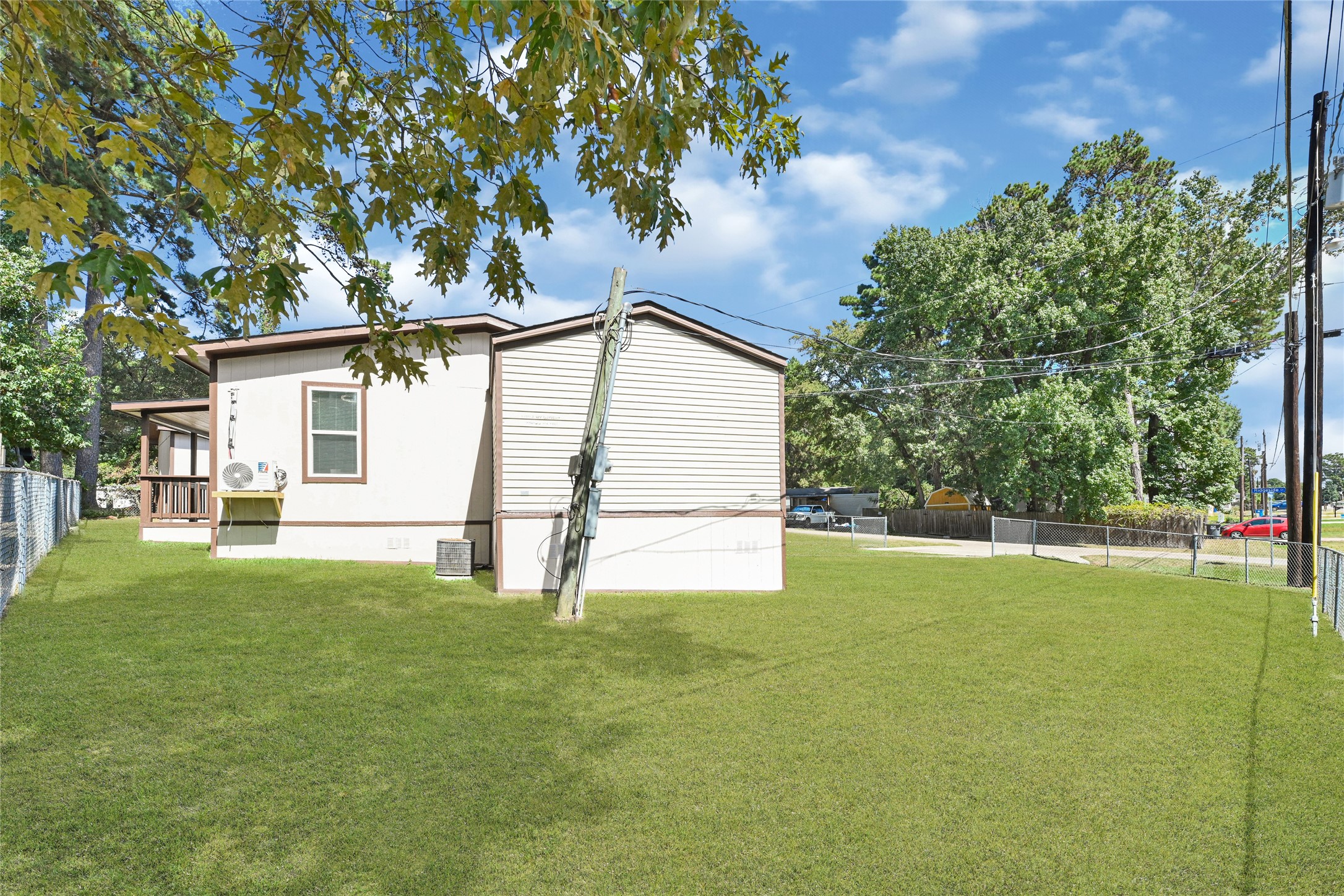 16794 Balmoral Street Montgomery, TX 77316 - Photo 3 of 24 a house with a yard and a large tree