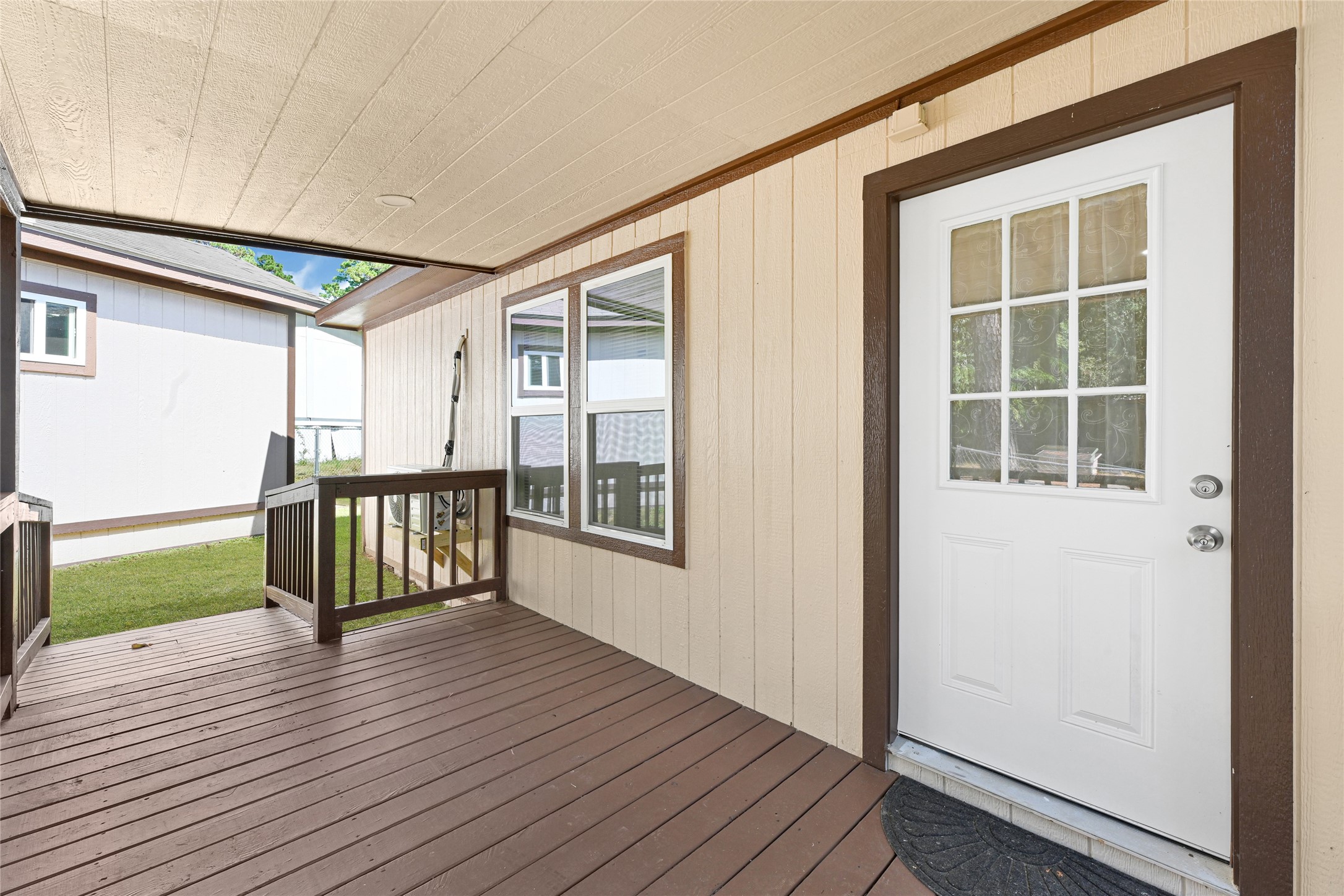 16794 Balmoral Street Montgomery, TX 77316 - Photo 4 of 24 a view of outdoor space with wooden floor and windows