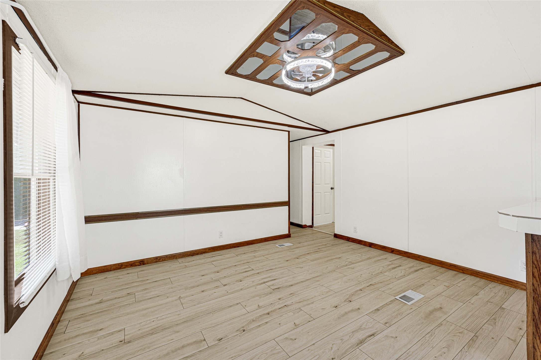 16794 Balmoral Street Montgomery, TX 77316 - Photo 9 of 24 a view of a hallway with wooden floor
