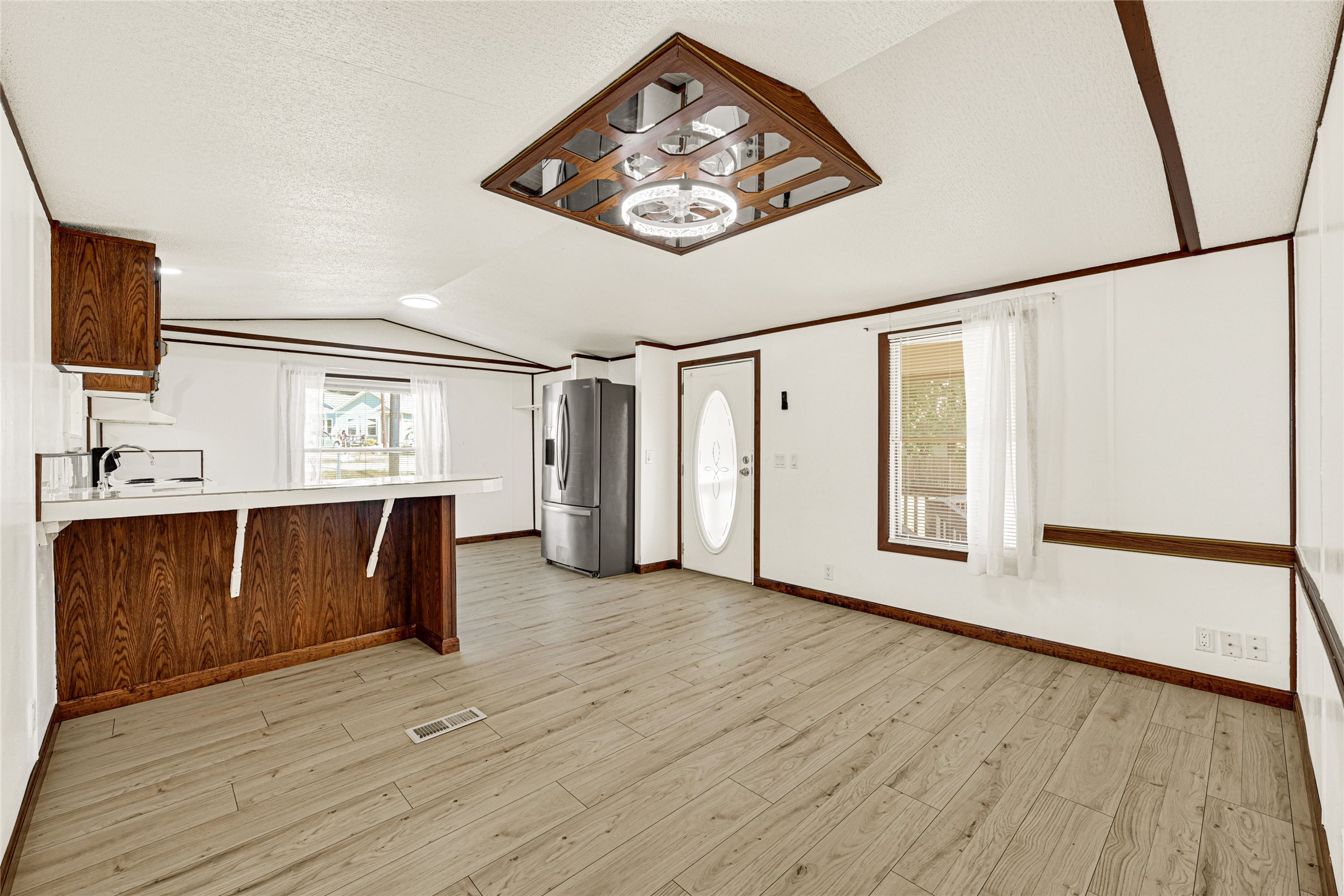 16794 Balmoral Street Montgomery, TX 77316 - Photo 10 of 24 a view of a hallway with wooden floor