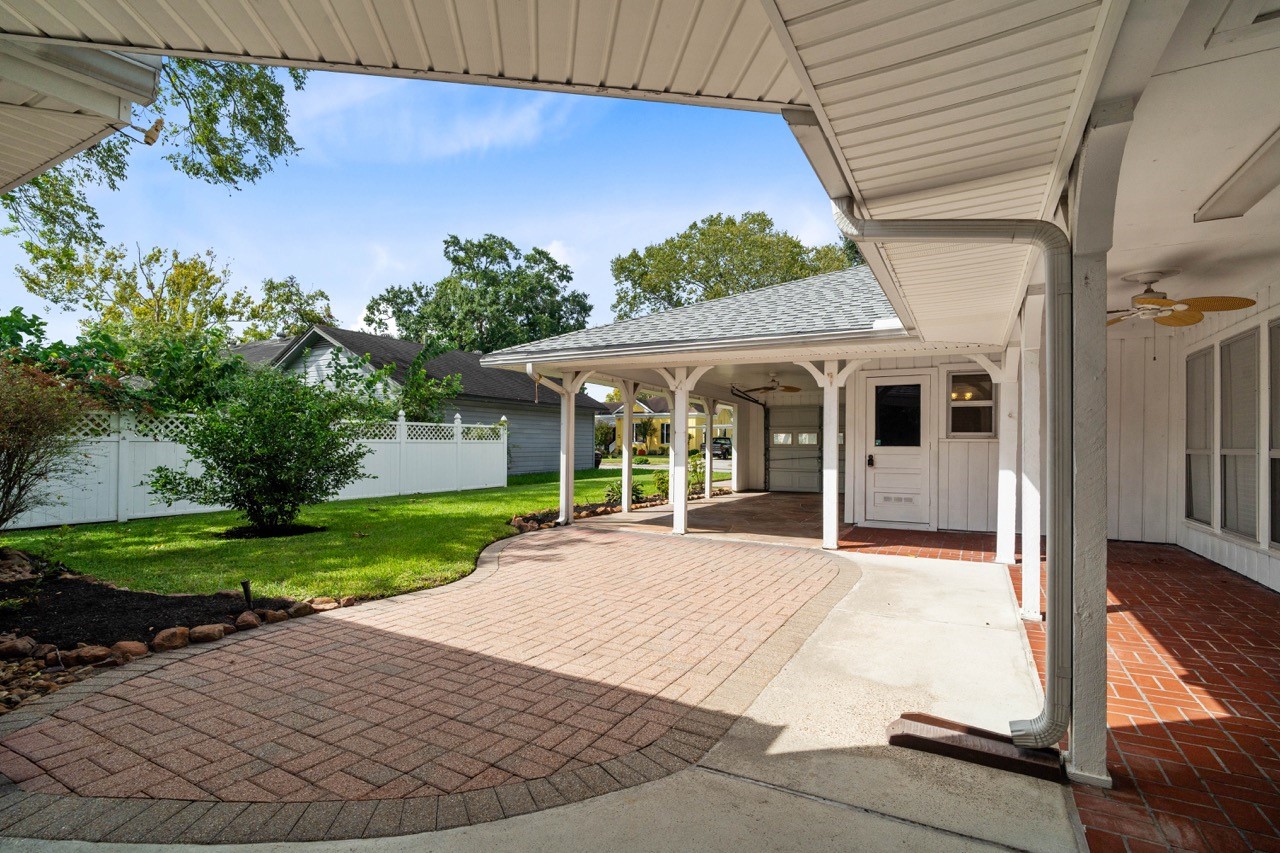 702 3rd Street Humble, TX 77338 - Photo 10 of 44 So much area offered on this back, covered, patio. Enjoy entertaining family and friends with plenty of area to place patio furniture and watch the game outside while BBQing. Enclosed the side of the carport and have an added man cave, or she shed!