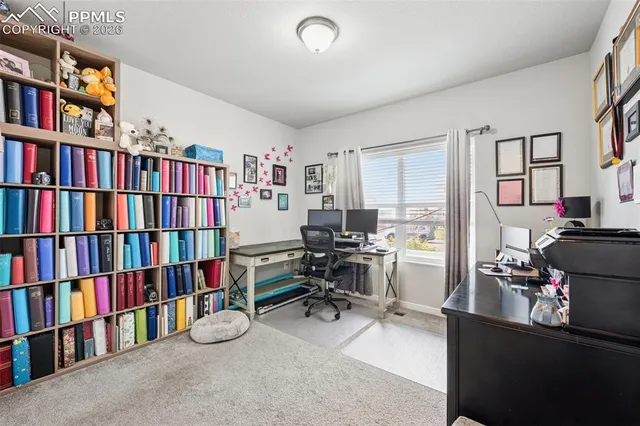 a bathroom with double vanity sink a toilet and a large mirror