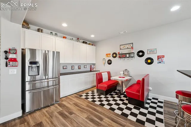 a room with wooden floor and furniture