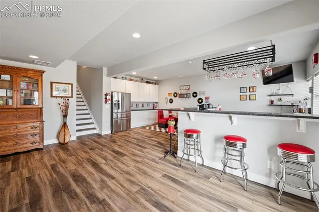 a bathroom with a sink mirror and vanity