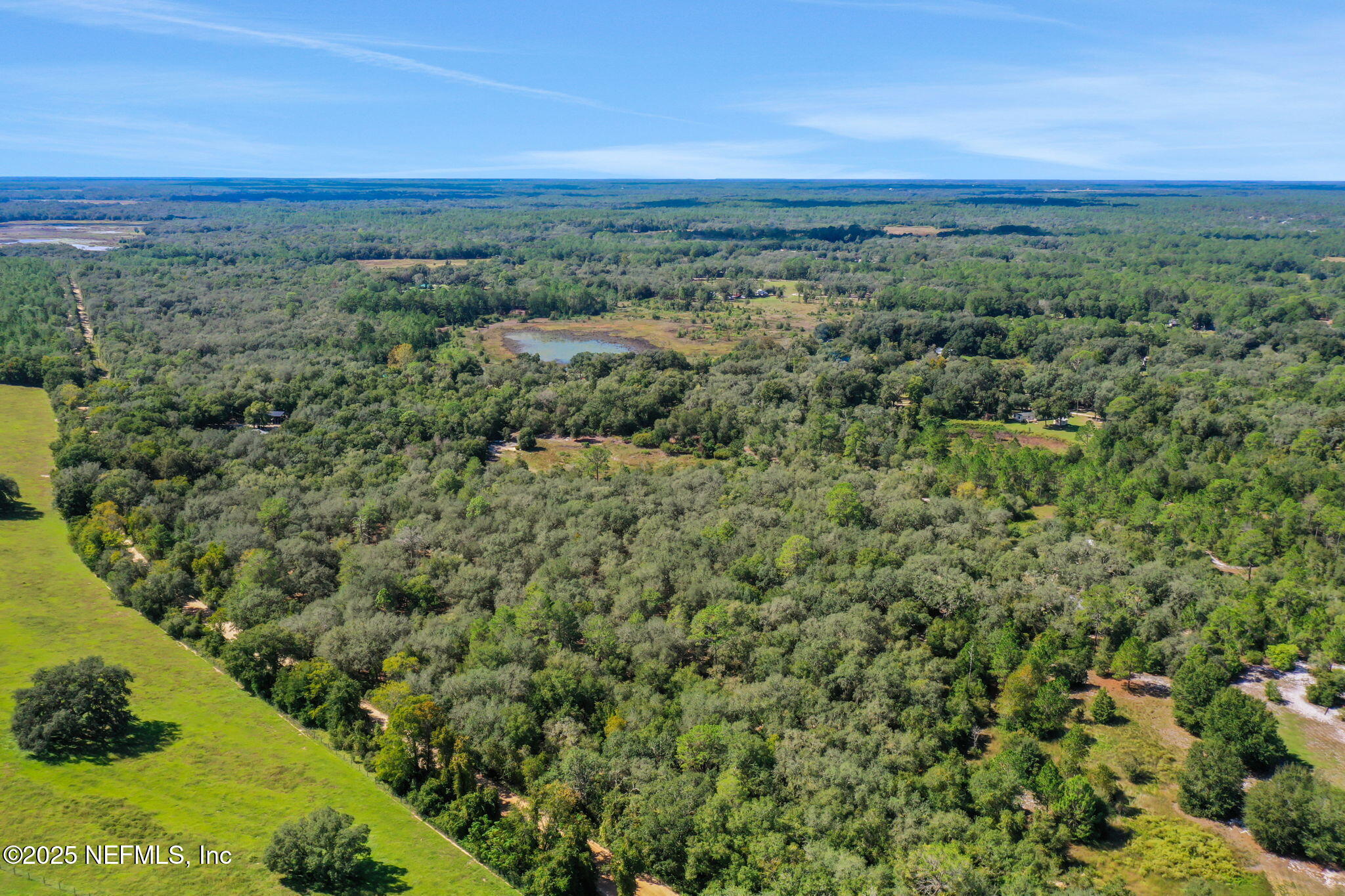 0 Old Bundy Lake Road Melrose, FL 32666 - Photo 12 of 13 a view of a city with lush green forest
