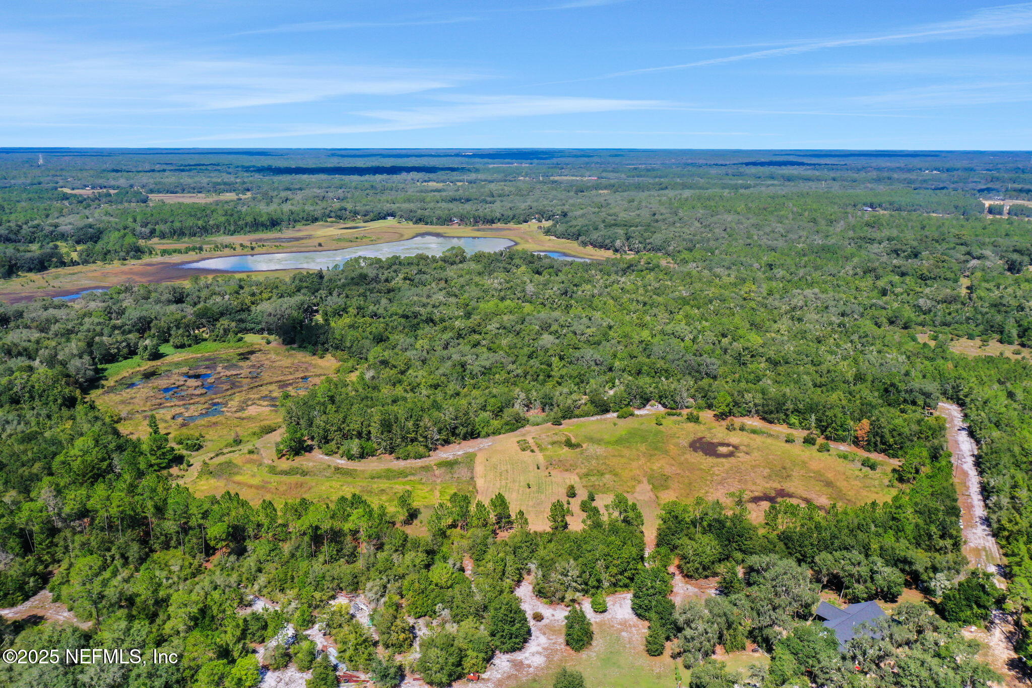 0 Old Bundy Lake Road Melrose, FL 32666 - Photo 13 of 13 a view of a lake and a mountain