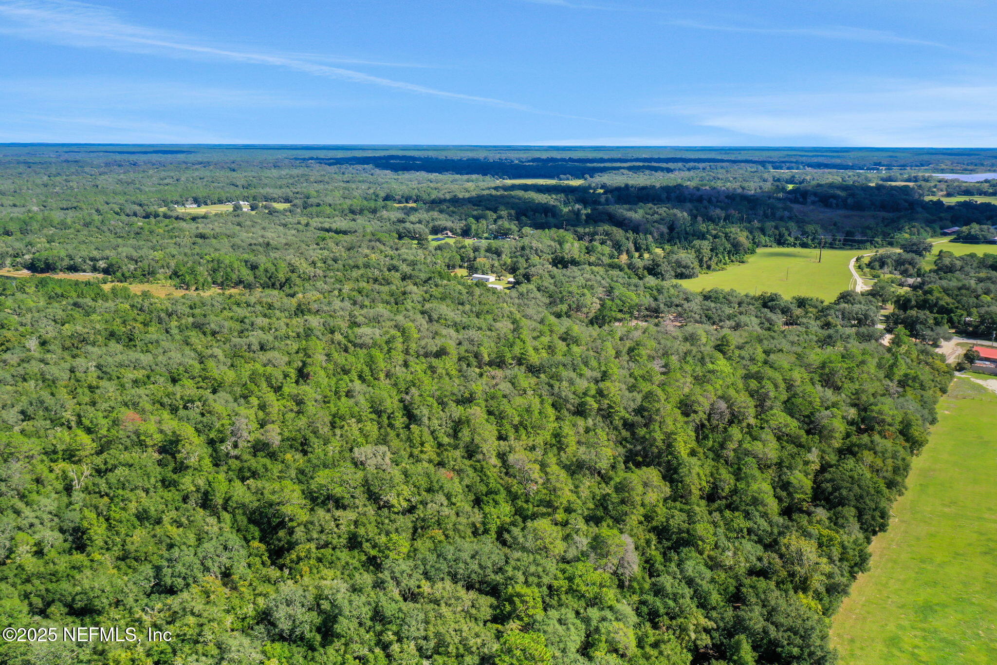 0 Old Bundy Lake Road Melrose, FL 32666 - Photo 2 of 13 a view of a green field with an ocean view