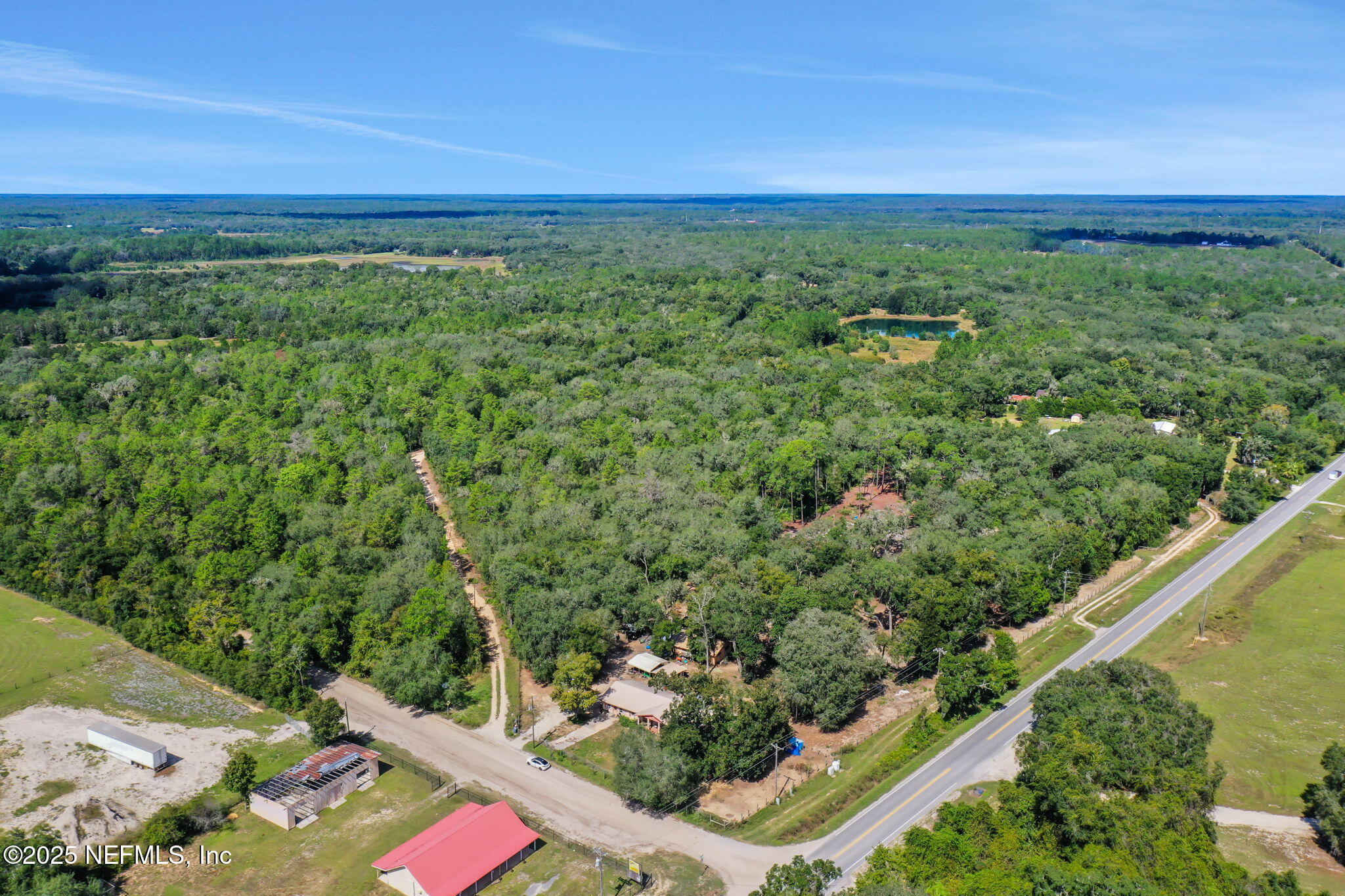 0 Old Bundy Lake Road Melrose, FL 32666 - Photo 5 of 13 a view of a city with lush green forest