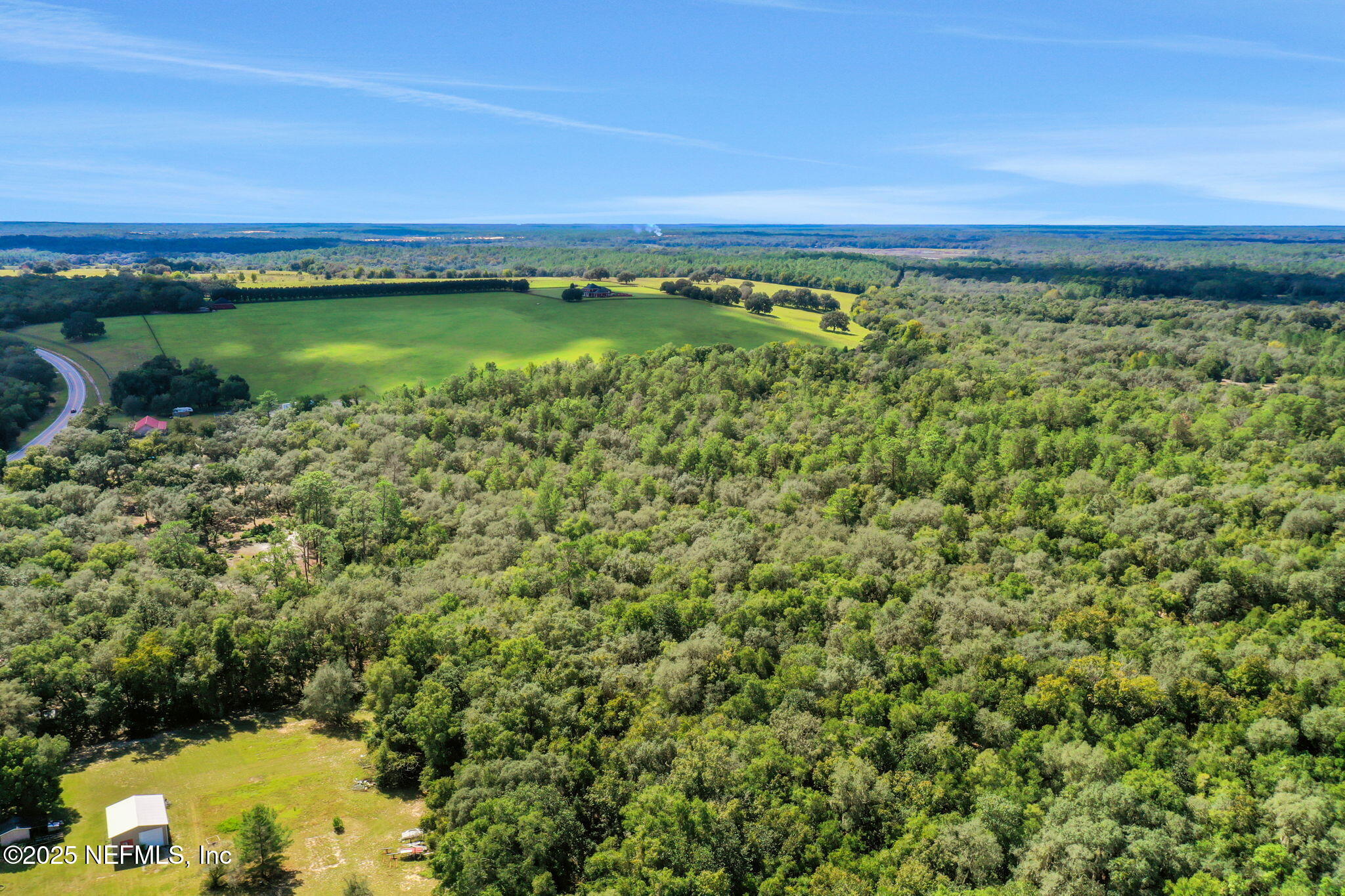 0 Old Bundy Lake Road Melrose, FL 32666 - Photo 6 of 13 a view of a lake with a city