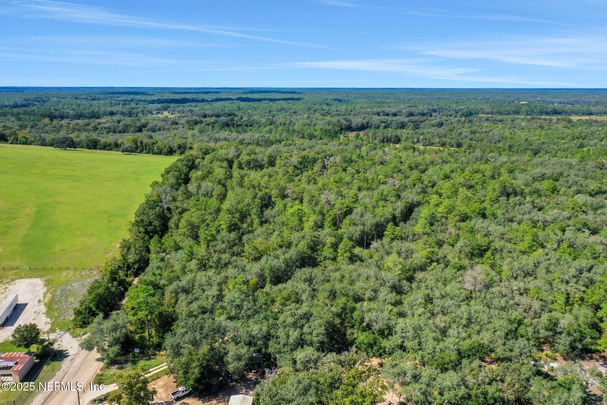 0 Old Bundy Lake Road Melrose, FL 32666 - Photo 9 of 13 a view of a green field with an ocean