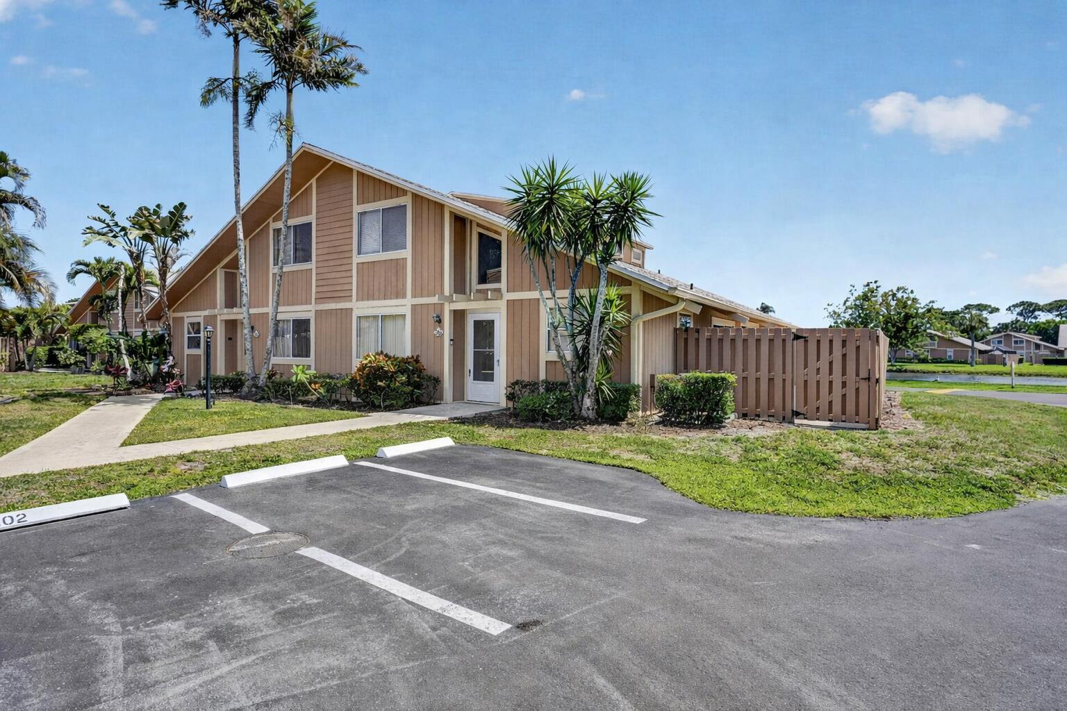 102 Maplecrest Circle Jupiter, FL 33458 - Photo 2 of 39 Front with 2 assigned parking