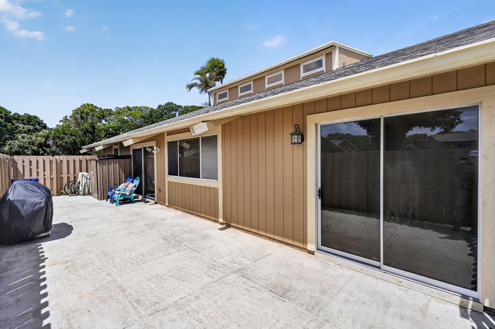 102 Maplecrest Circle Jupiter, FL 33458 - Photo 32 of 39 fenced patio from great room