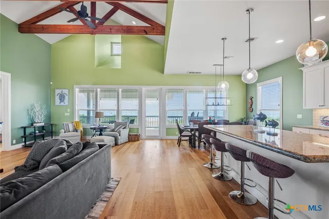 a large kitchen with a table and chairs