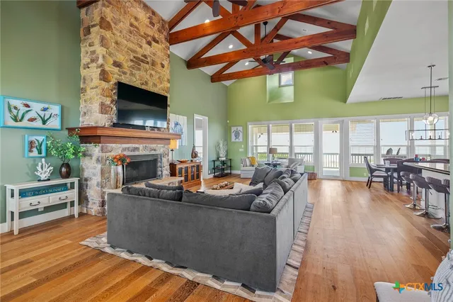 a living room with fireplace furniture and a flat screen tv
