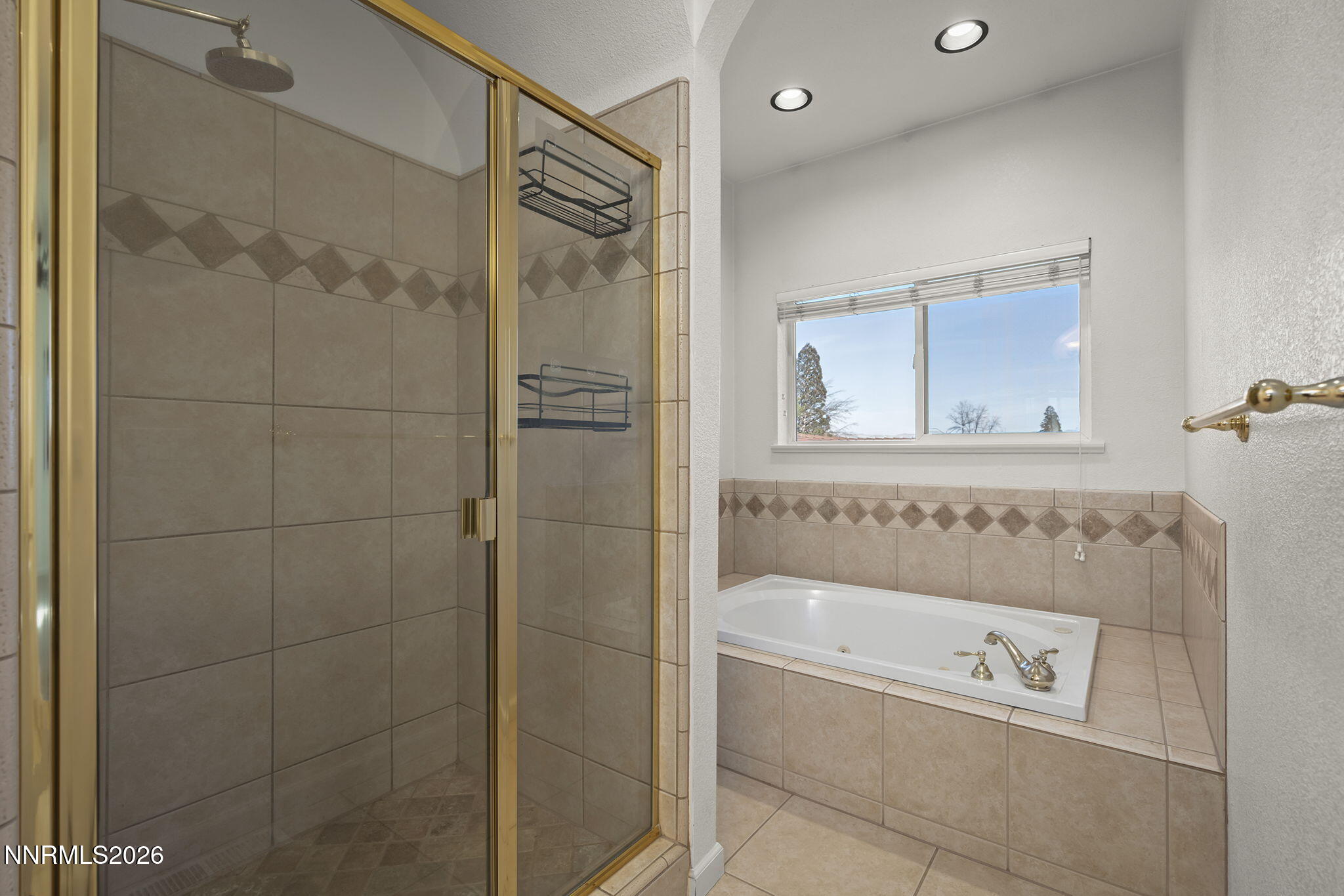 474 West Plumb Lane Reno, NV 89509 - Photo 11 of 35 a bathroom with a bathtub and a shower