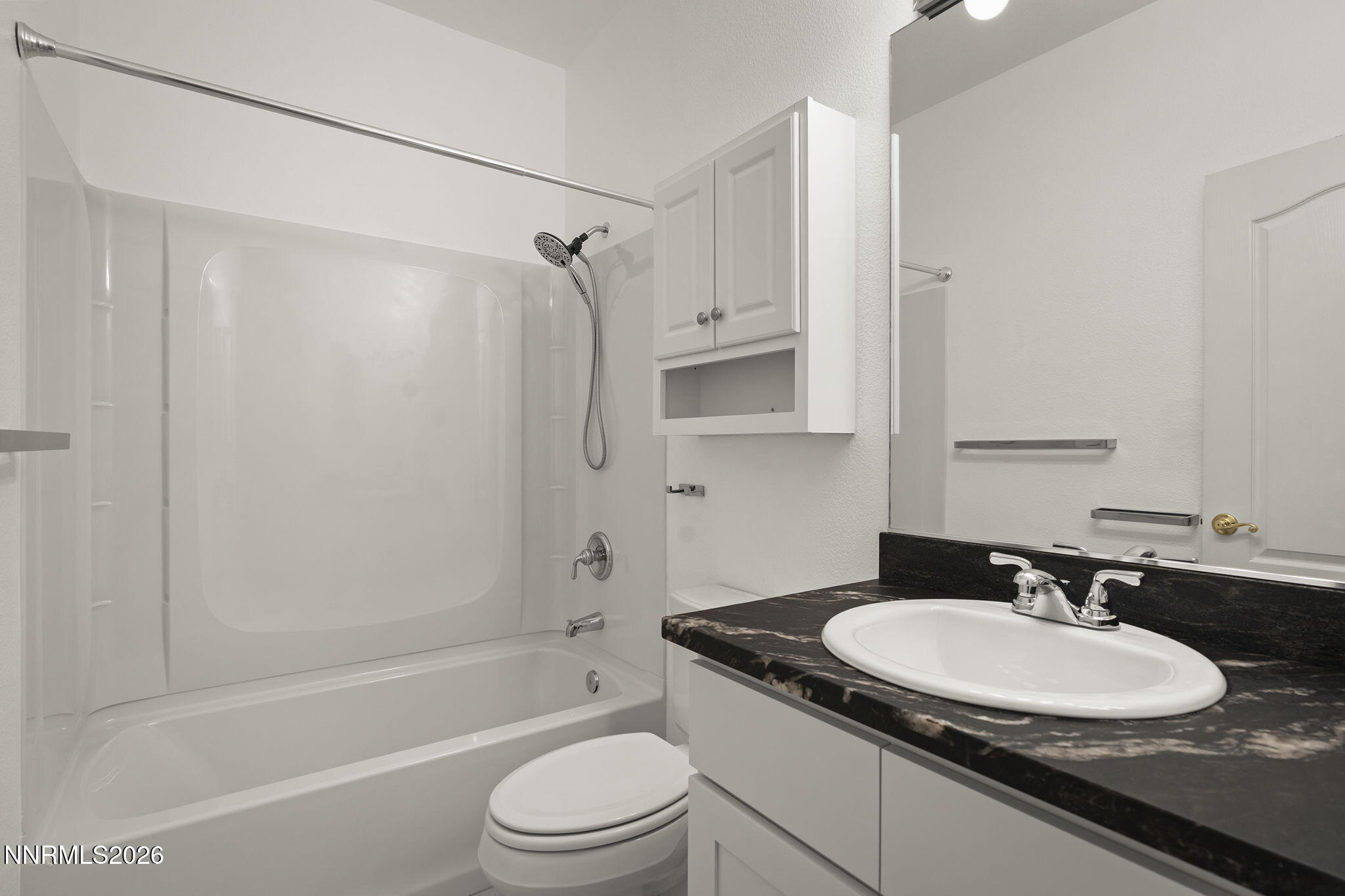 474 West Plumb Lane Reno, NV 89509 - Photo 13 of 35 a bathroom with a granite countertop sink toilet and shower