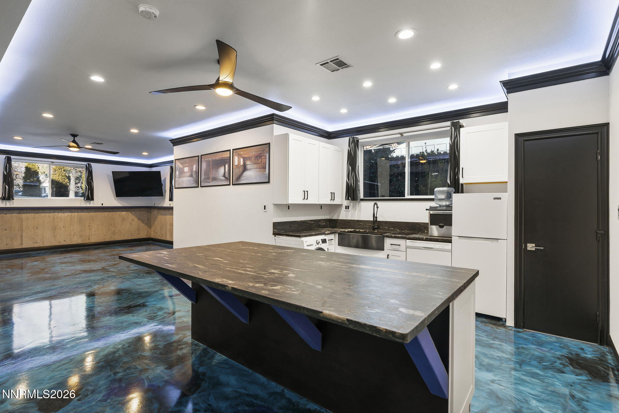 474 West Plumb Lane Reno, NV 89509 - Photo 18 of 35 a large kitchen with stainless steel appliances granite countertop a large counter top and wooden floors