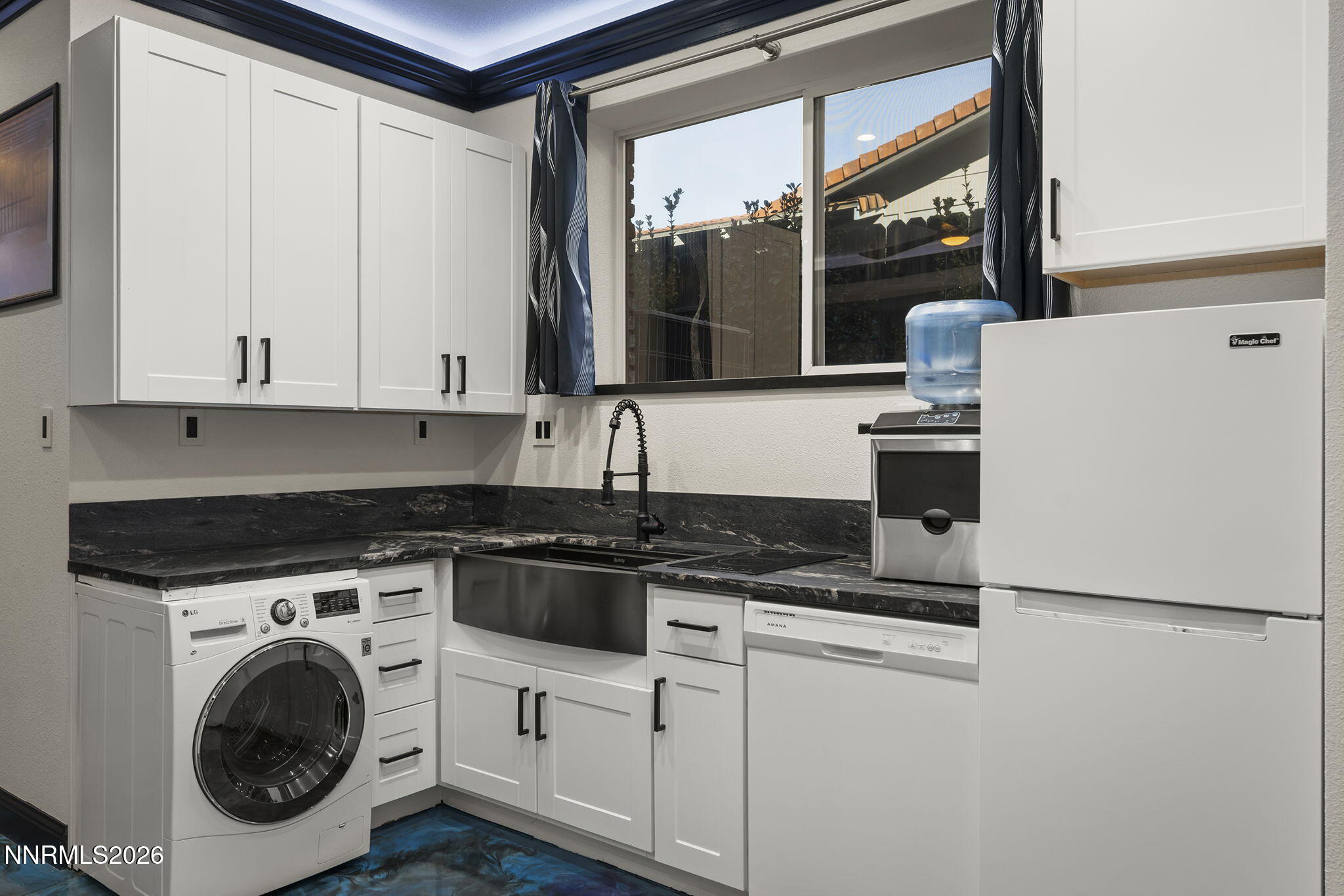 474 West Plumb Lane Reno, NV 89509 - Photo 19 of 35 a kitchen with granite countertop white cabinets and white appliances