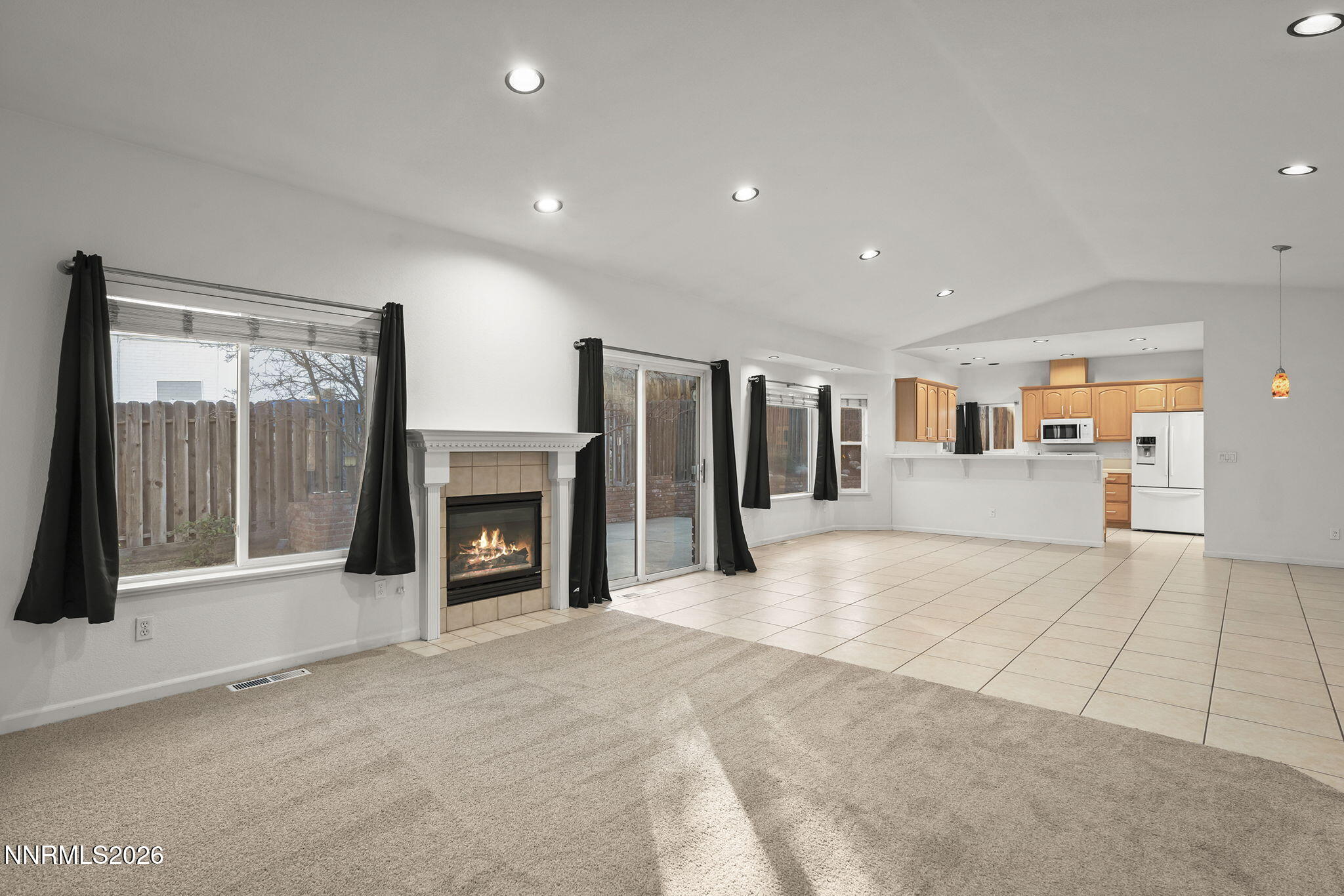 474 West Plumb Lane Reno, NV 89509 - Photo 2 of 35 a view of an empty room with fireplace and a window