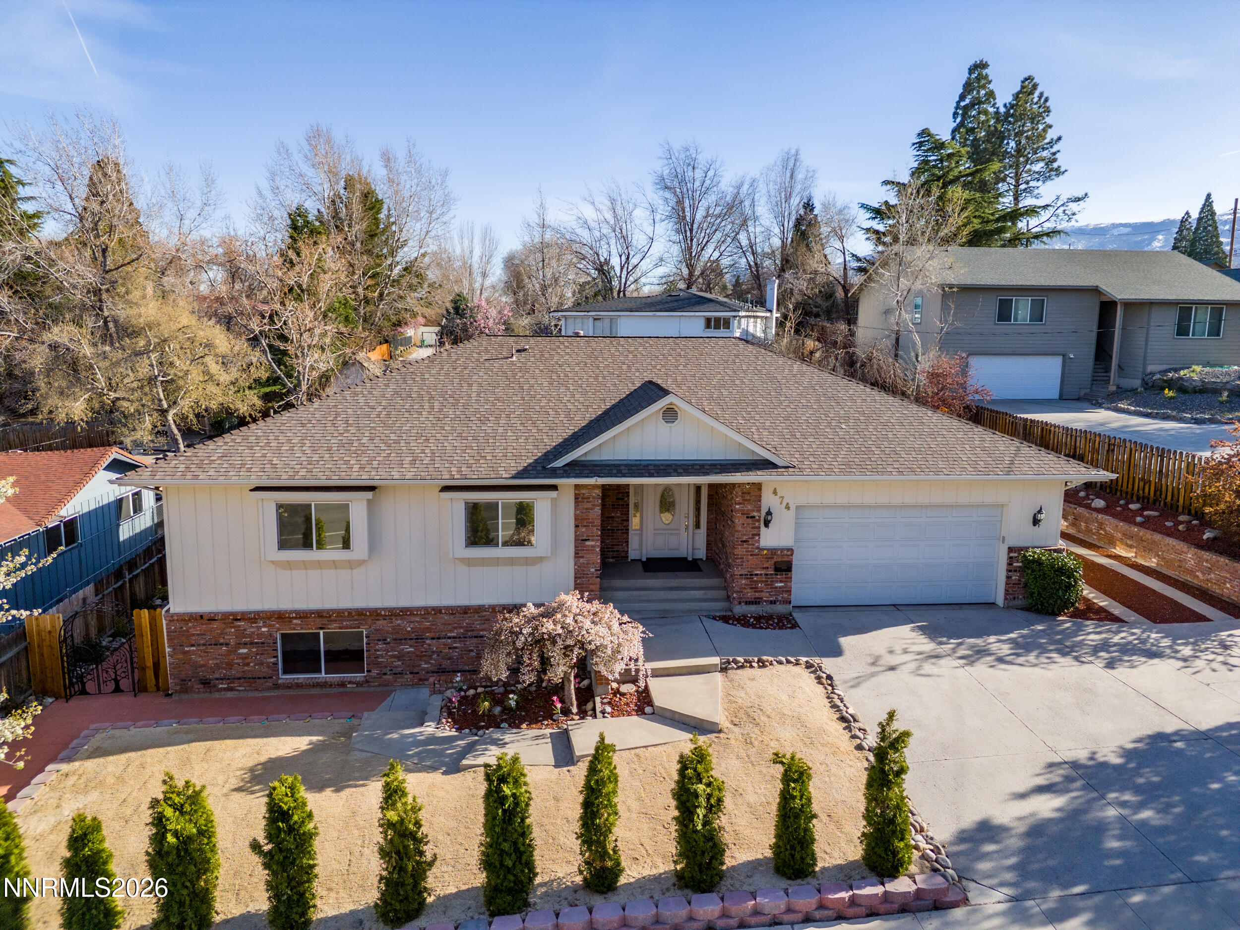 474 West Plumb Lane Reno, NV 89509 - Photo 29 of 35 a front view of house with yard outdoor seating and barbeque oven