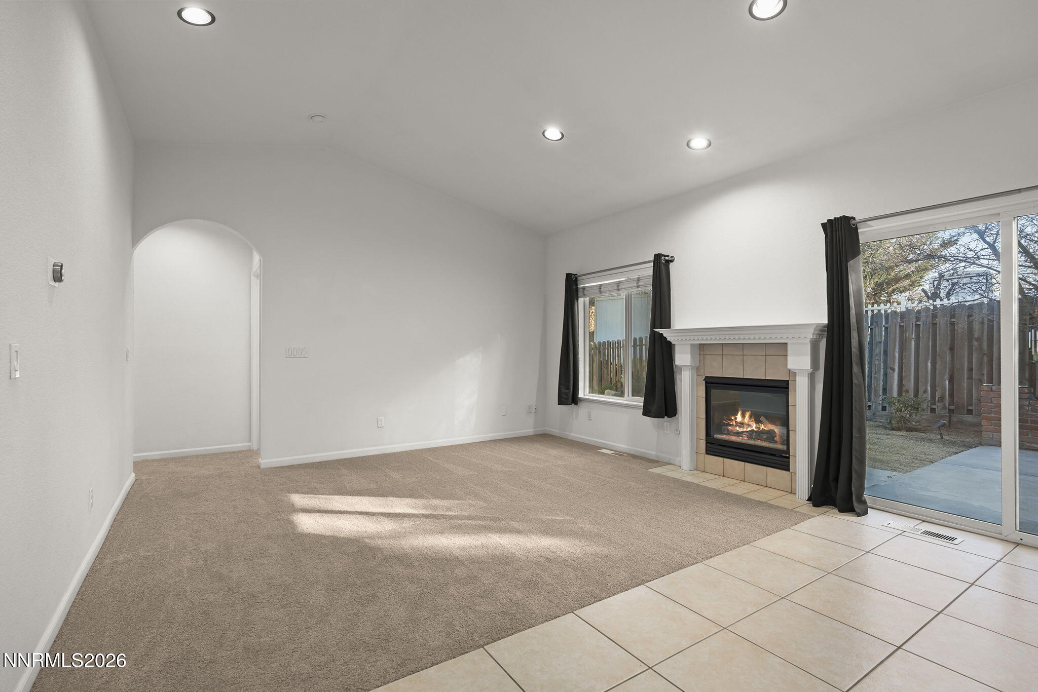 474 West Plumb Lane Reno, NV 89509 - Photo 3 of 35 a view of an empty room with a fireplace