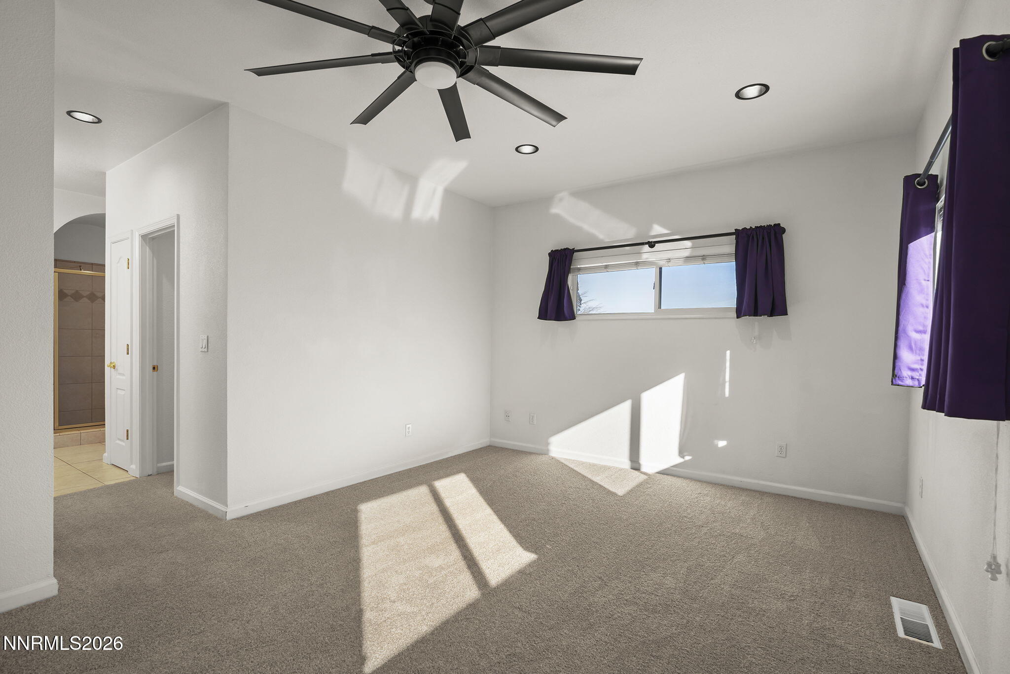 474 West Plumb Lane Reno, NV 89509 - Photo 9 of 35 a view of an empty room with window and fan