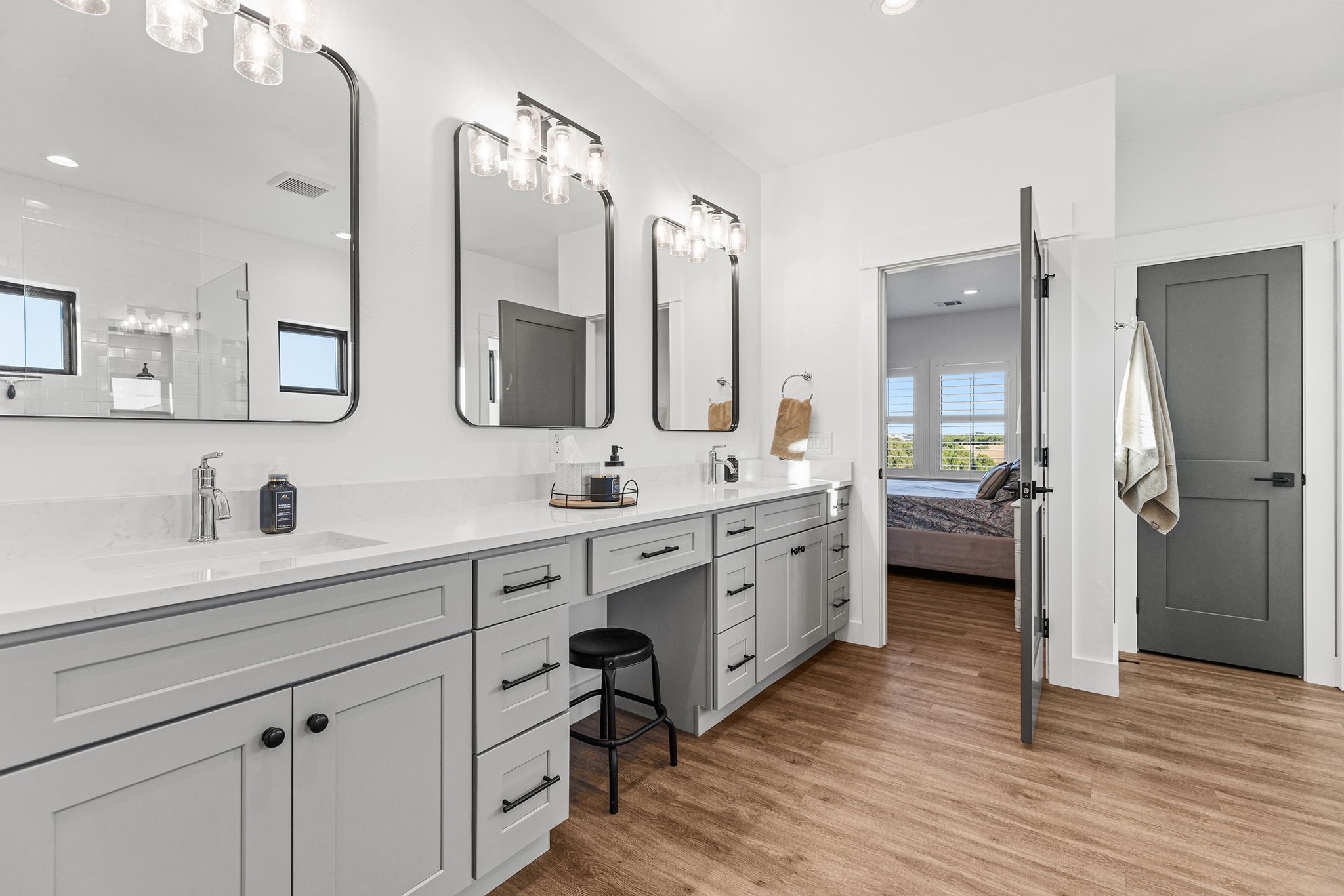 345 Judge's Road Burnet, TX 78611 - Photo 19 of 40 a spacious bathroom with a double vanity sink a mirror and a shower