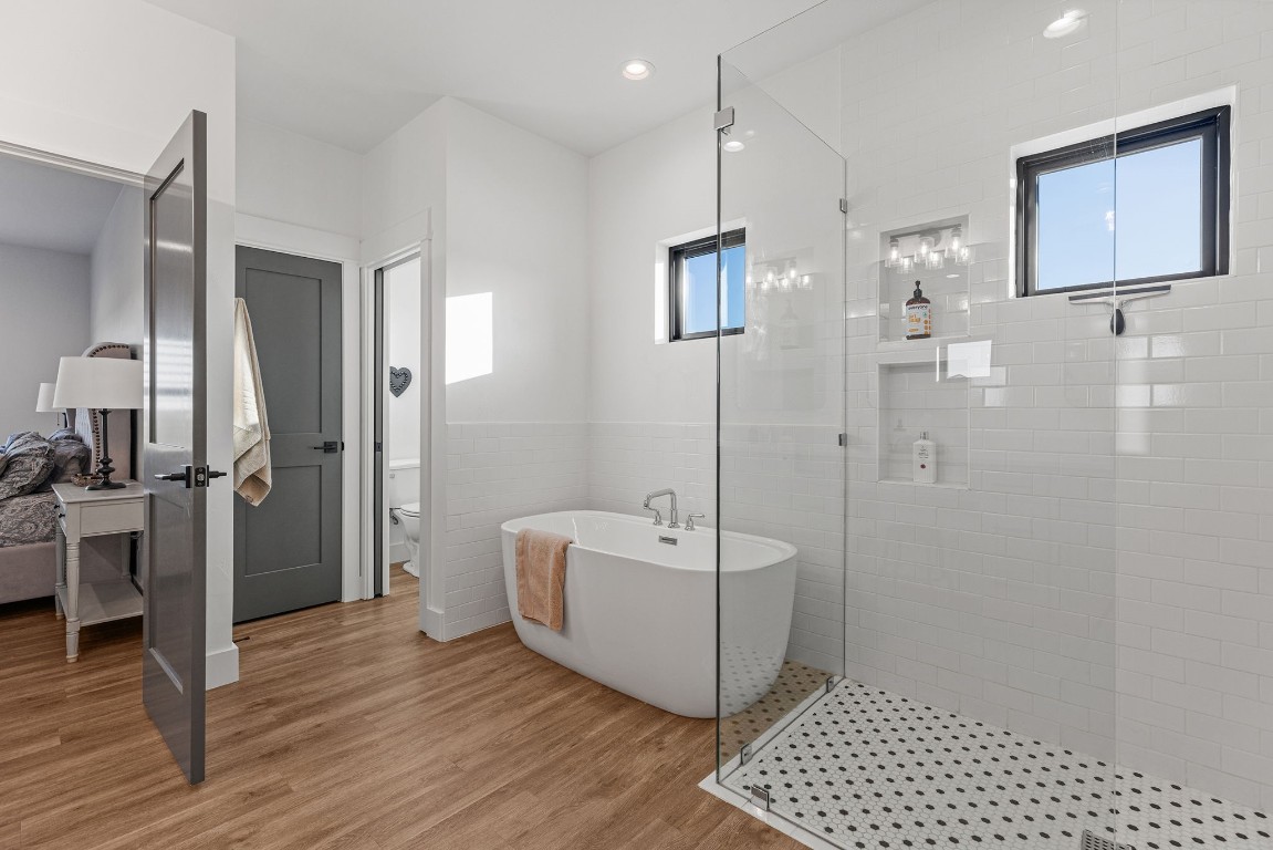 345 Judge's Road Burnet, TX 78611 - Photo 20 of 40 a spacious bathroom with a sink a mirror and a shower