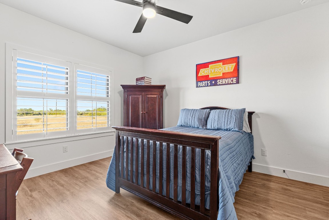 345 Judge's Road Burnet, TX 78611 - Photo 21 of 40 a bed room with a bed and a window