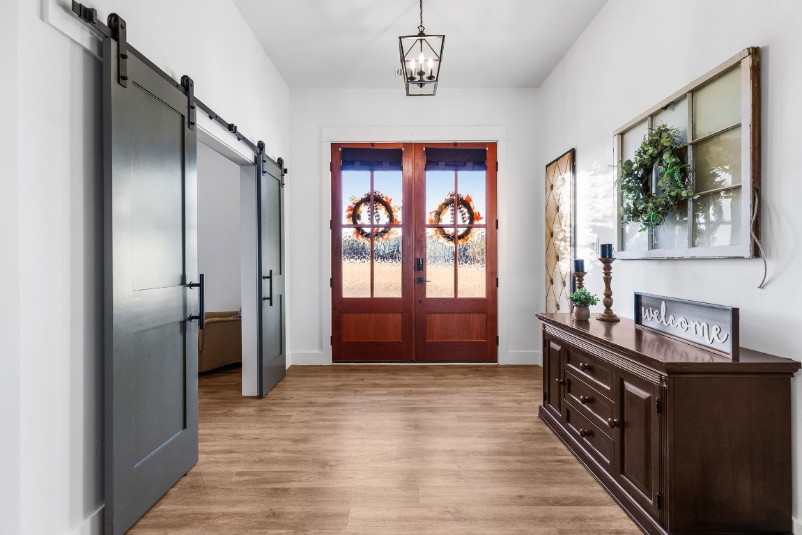 345 Judge's Road Burnet, TX 78611 - Photo 4 of 40 a view of a kitchen cabinets a window and wooden floor
