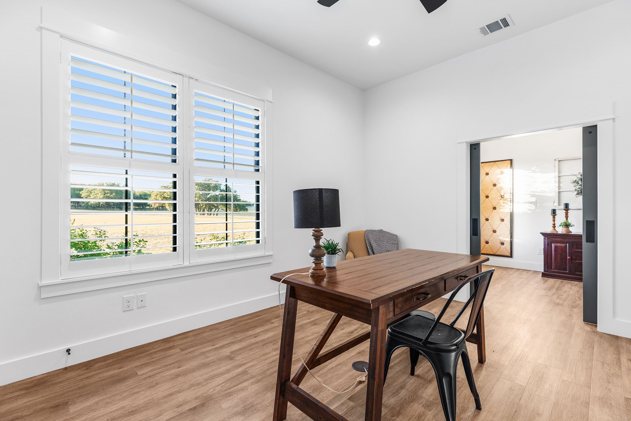 345 Judge's Road Burnet, TX 78611 - Photo 5 of 40 a view of a dining room with furniture and wooden floor
