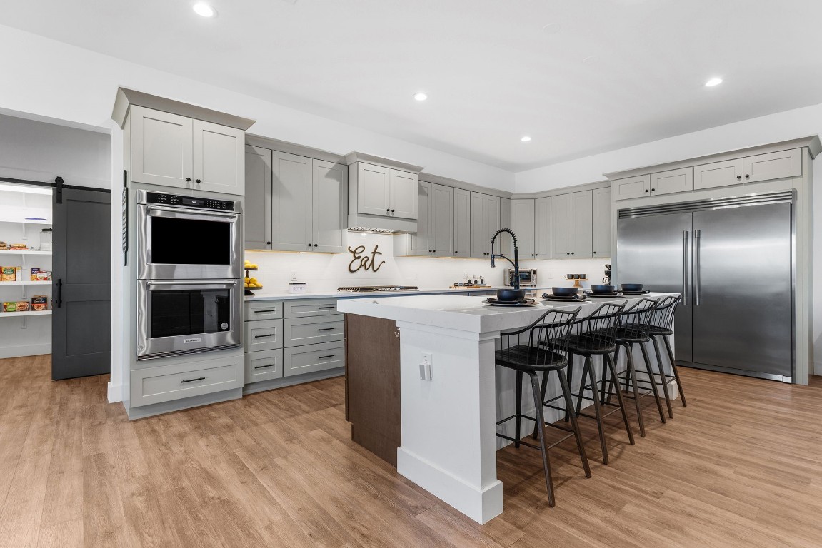 345 Judge's Road Burnet, TX 78611 - Photo 10 of 40 a kitchen with a sink stainless steel appliances and cabinets