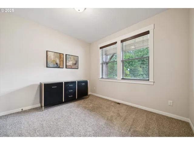 a room with a bed and a window