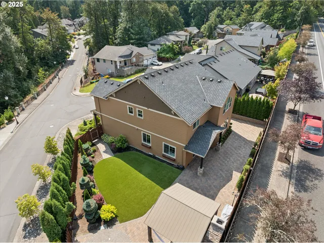 an aerial view of a house with a garden