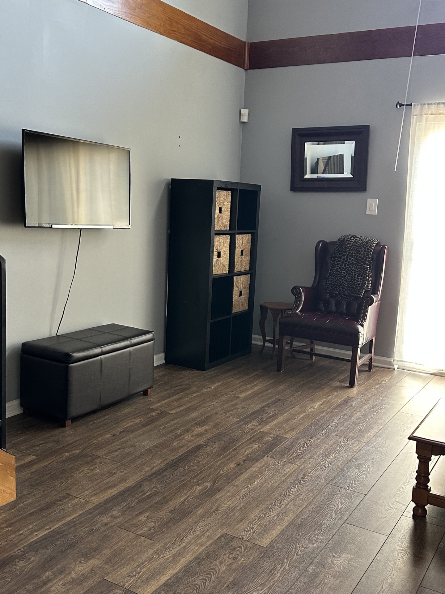 2215 Post Road, Unit 2044 Austin, TX 78704 - Photo 10 of 34 Rich wood-look flooring and prominent overhead beams define this versatile living area.