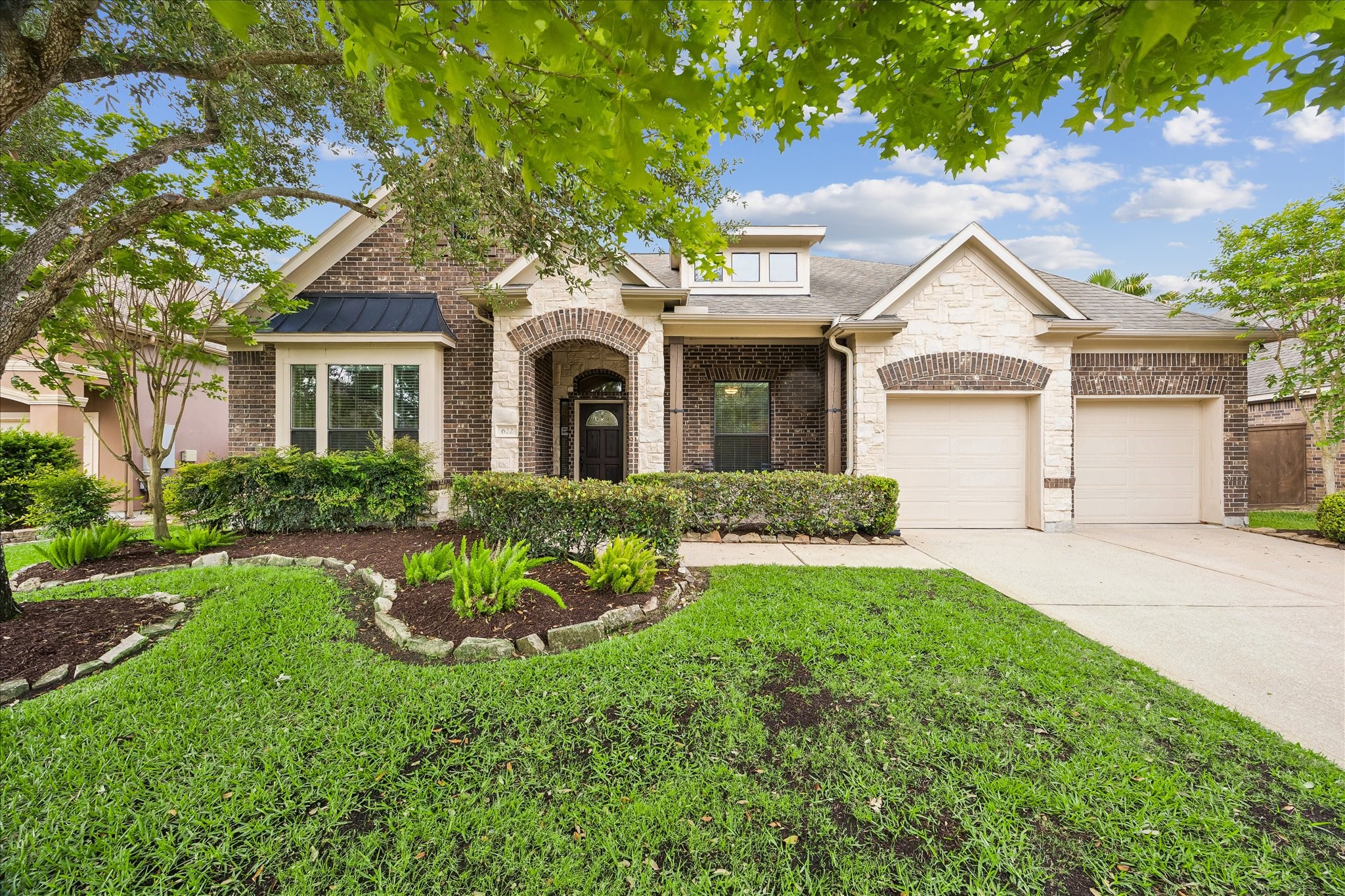 A welcoming first impression with brick and stone home with strong curb appeal, landscaped yard, mature trees in Edgewater neighborhood.  1 1/2 stories giving you what you desire in a 1 story with the extra space (and bathroom) of an extra floor