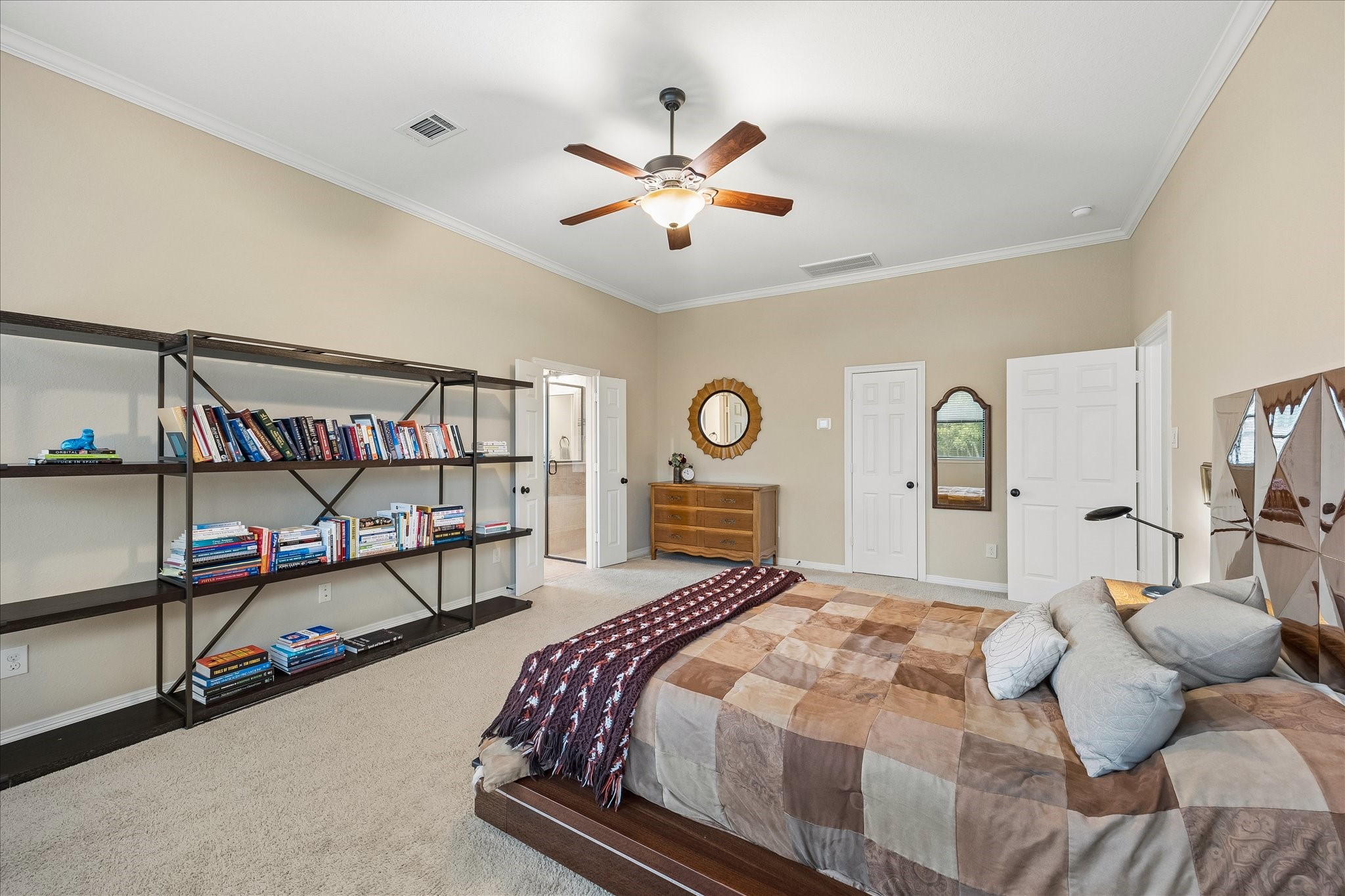 622 West Fork Webster, TX 77598 - Photo 15 of 36 The downstairs primary suite offers a spacious retreat on the main level. It also features TWO walk-in closets - one in the bedroom and one off the ensuite. No more fighting over space