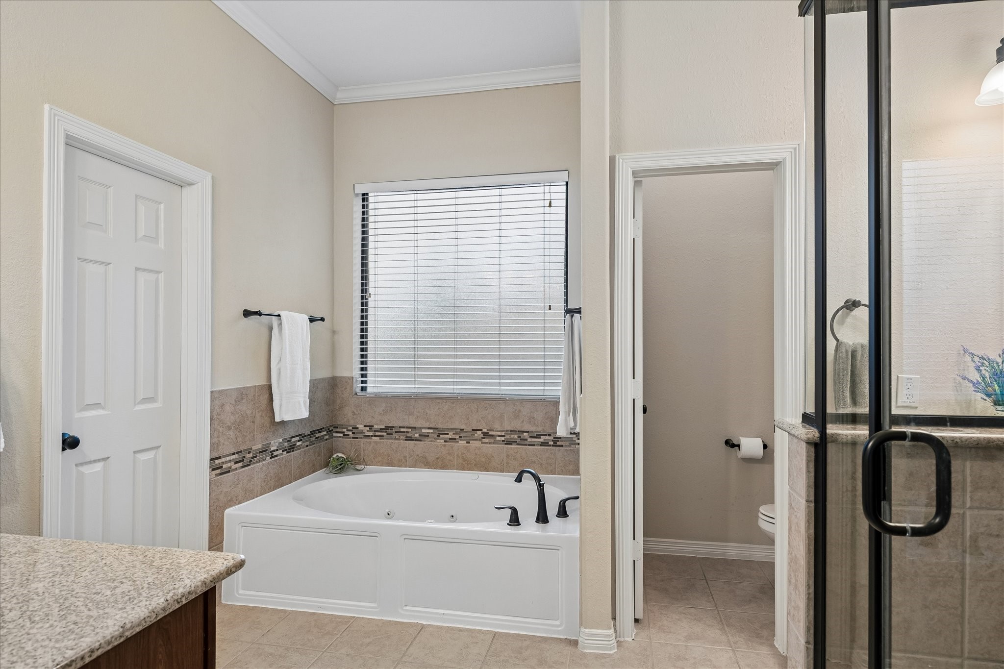 622 West Fork Webster, TX 77598 - Photo 16 of 36 The primary bath includes double sinks, a jetted tub, and a separate shower offering a comfortable retreat feel