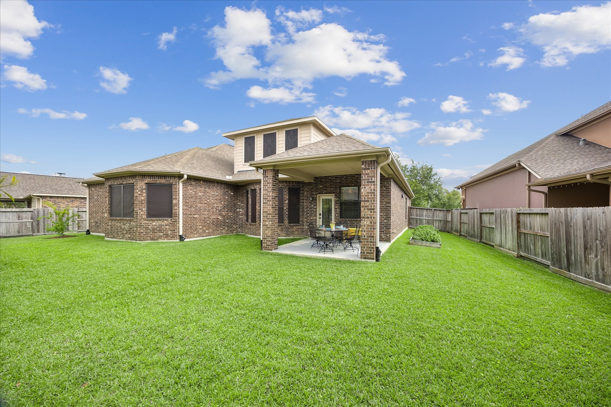 622 West Fork Webster, TX 77598 - Photo 26 of 36 A covered patio and fenced yard complete the home’s outdoor appeal. The fence is just a few years old! Notice the gutters as well