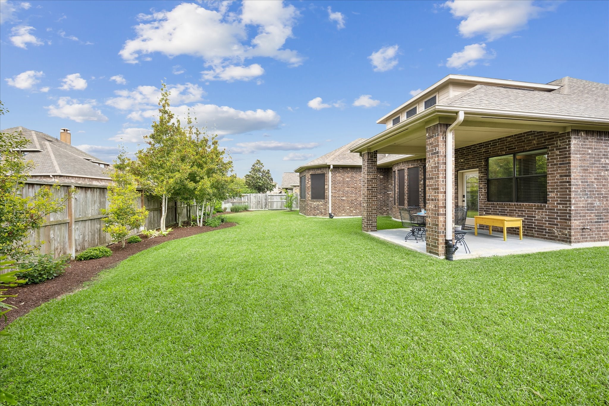 622 West Fork Webster, TX 77598 - Photo 27 of 36 The backyard offers open green space with room to enjoy, play, or entertain. Notice the landscaping as well - chosen to withstand heat and freezing temperatures