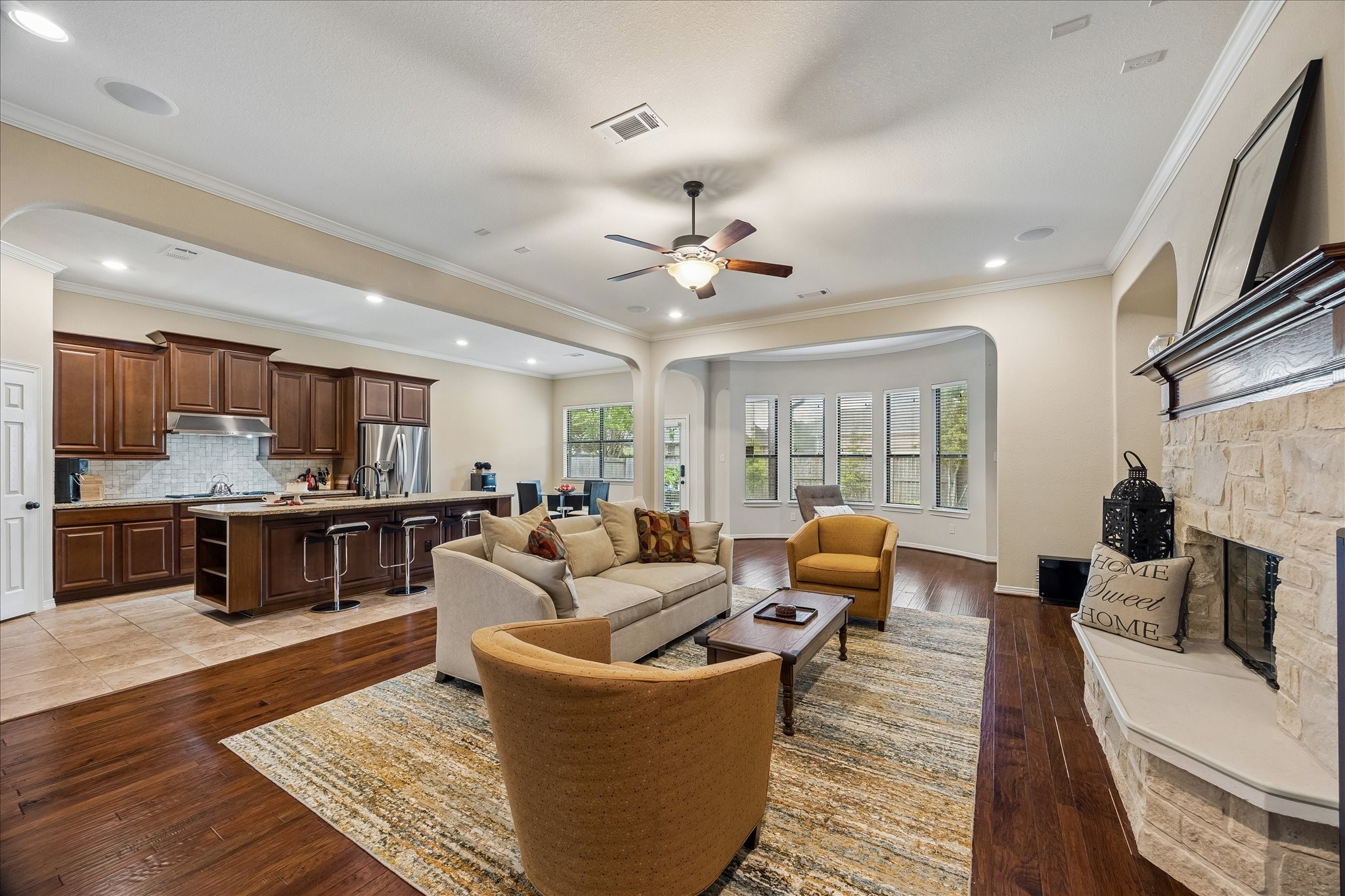 622 West Fork Webster, TX 77598 - Photo 7 of 36 Open concept layout connecting living room and kitchen for easy flow for everyday living and entertaining. A bay windowed nook for relaxing as well. Speaking of entertaining notice built-in speakers!
