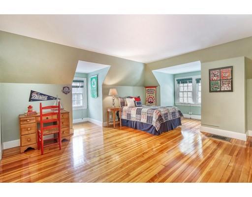 54 Pheasant Landing Road Needham, MA 02492 - Photo 22 of 30 a living room with furniture and a wooden floor