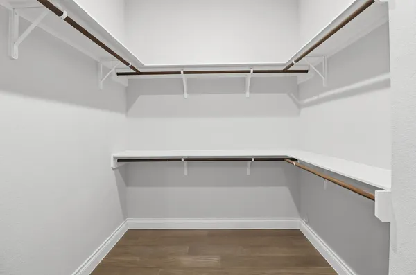 a view of an empty walk in closet