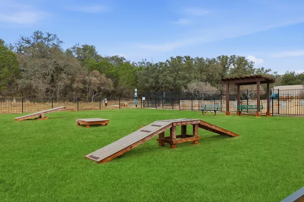 a view of a garden with a swimming pool