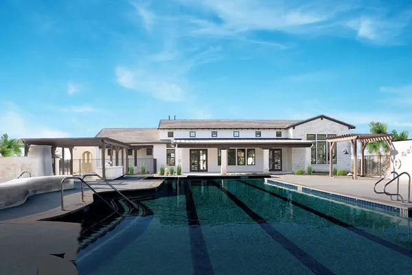 a front view of a house with a yard table and chairs