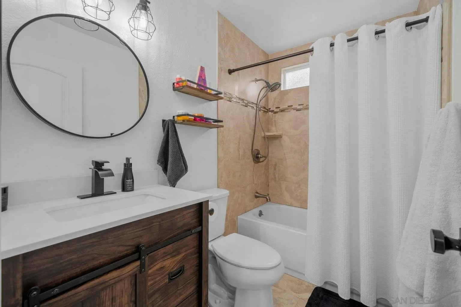 9026 Hamilton Street Rancho Cucamonga, CA 91701 - Photo 19 of 26 a bathroom with a sink a toilet and a mirror