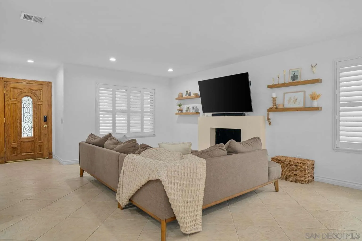 9026 Hamilton Street Rancho Cucamonga, CA 91701 - Photo 7 of 26 a living room with furniture and a flat screen tv
