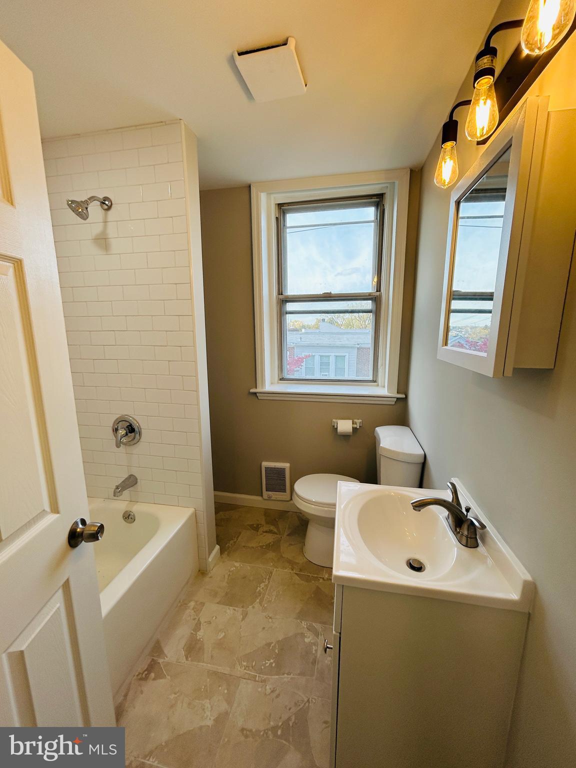 326 Fountain Street Philadelphia, PA 19128 - Photo 19 of 24 a bathroom with a sink a bathtub and a shower