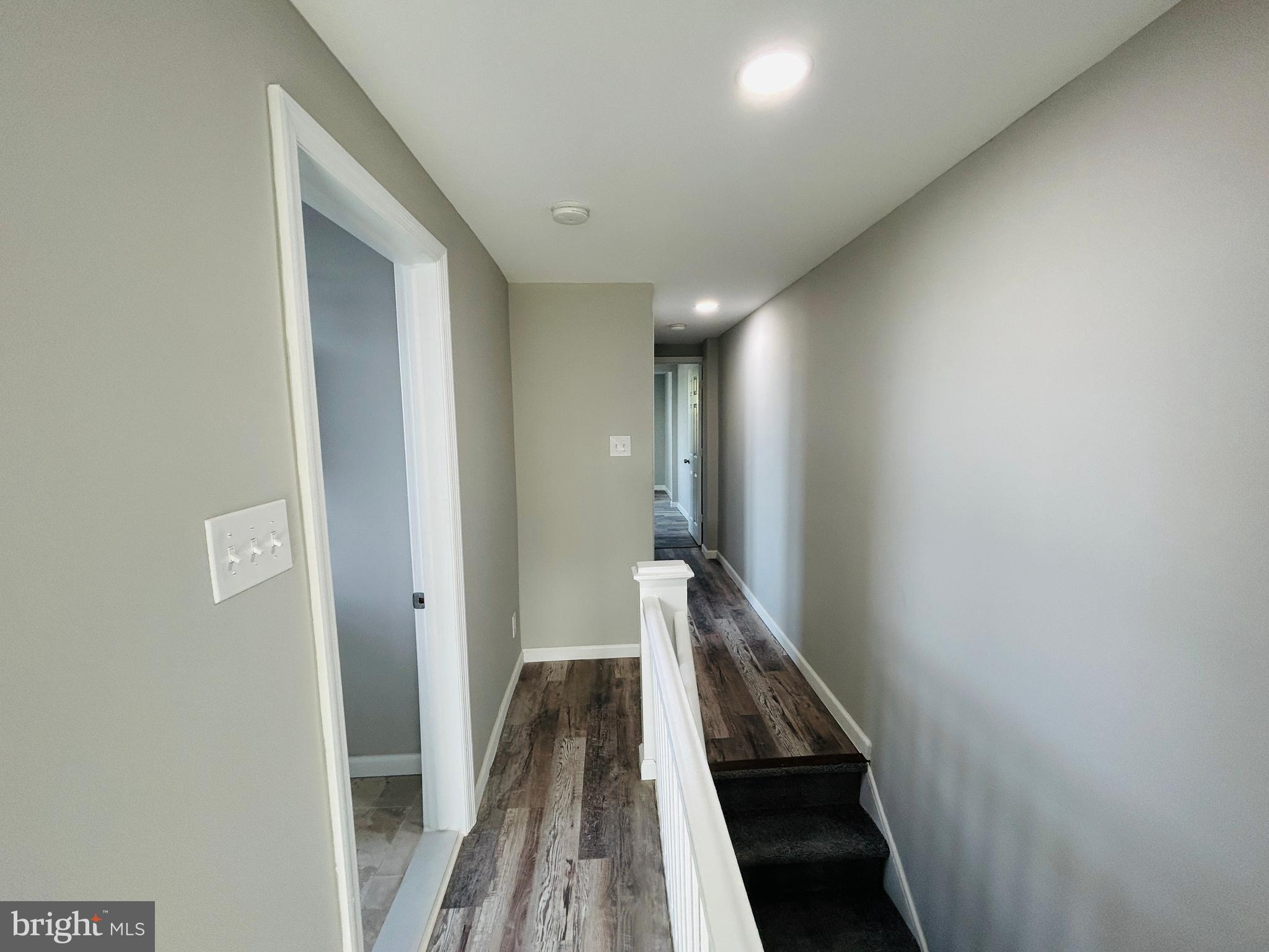 326 Fountain Street Philadelphia, PA 19128 - Photo 24 of 24 a view of a hallway with wooden floor and staircase