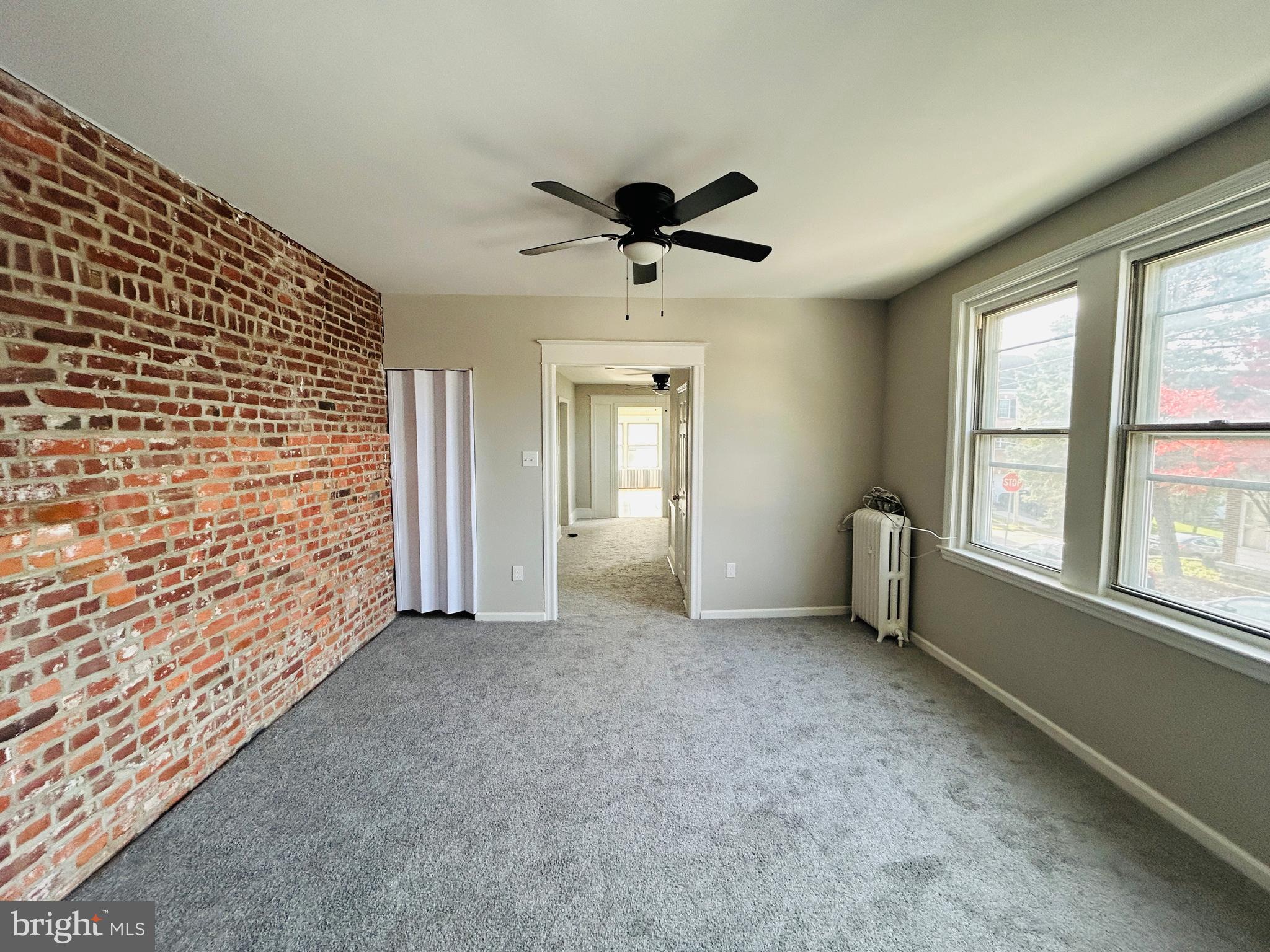 326 Fountain Street Philadelphia, PA 19128 - Photo 8 of 24 a view of an empty room with a window